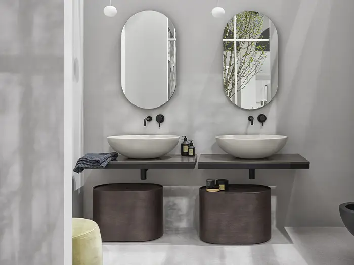 Badezimmer in Beton-Optik mit puristischen Waschbecken von der Rieger – Ihre Bäderschmiede